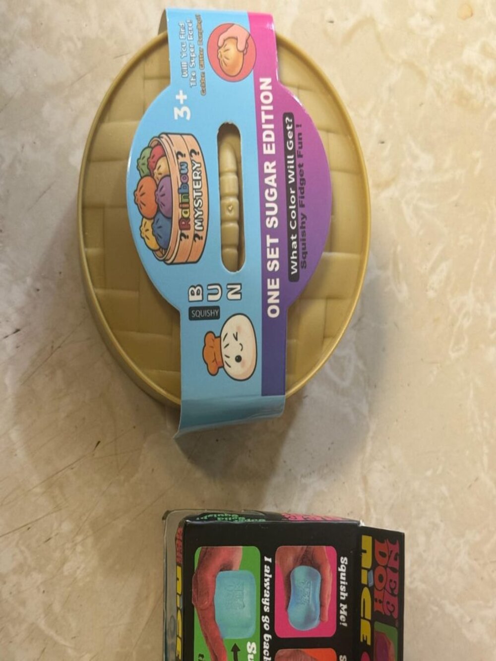 Bundle of 2 Sensory Fidget Toys – Bun Squishy Mystery + Nee Doh Nice Cube